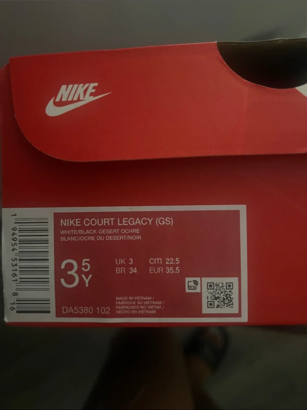 Nike Kids White Sneakers with Black Swoosh and Brown Trim